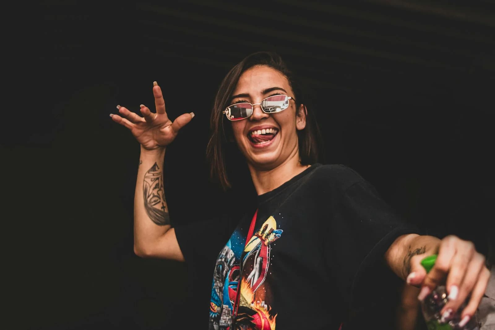 A woman laughing and celebrating at a party